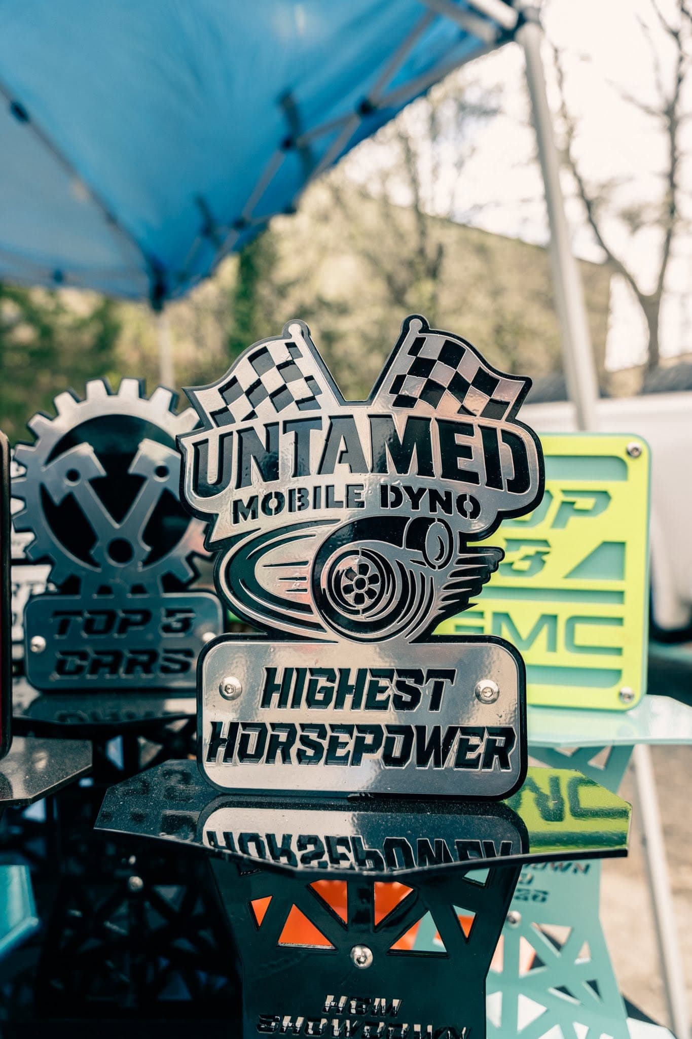 Custom laser-cut trophies fabricated by Bond Welding Service